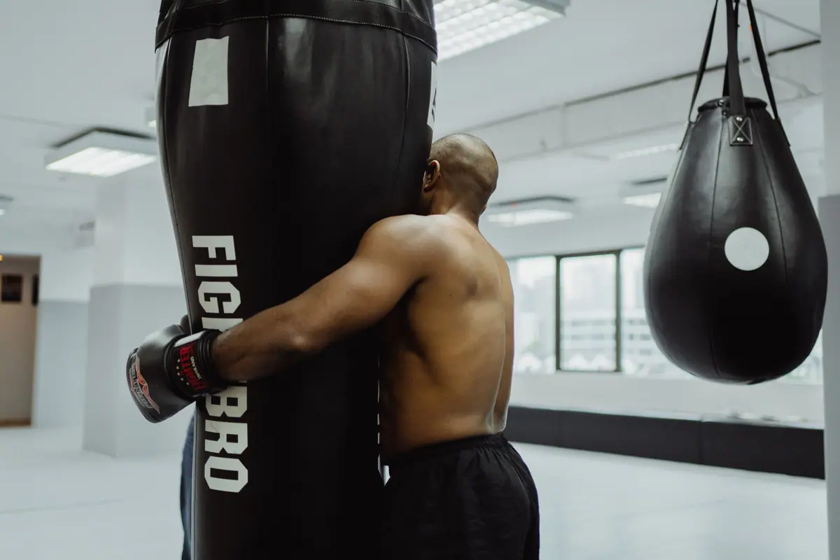 A boxer training on a heavy bag