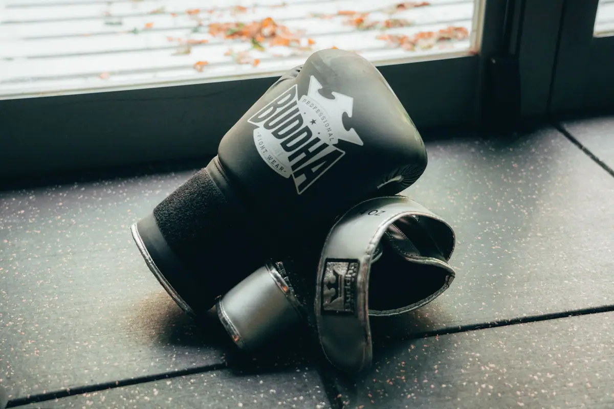 Boxing gloves lying on a gym floor